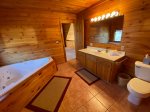 Loft Master Bathroom with a Shower Stall and Jetted Garden Tub